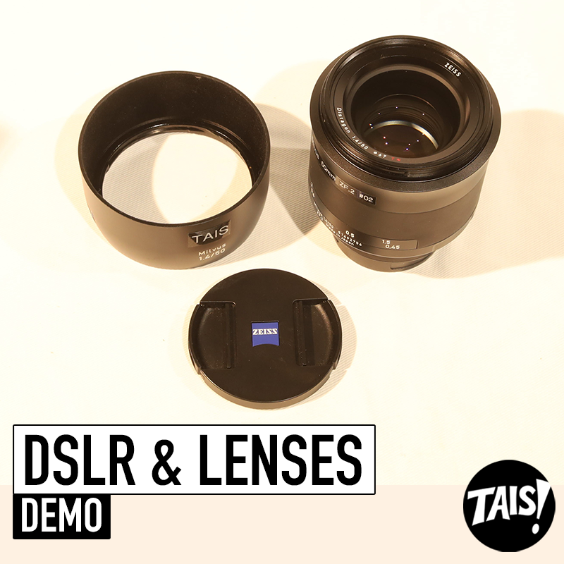 Zeiss lens and lens cap are in the studios with a white background.
